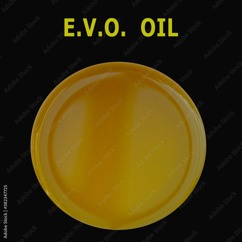 Close-up of extra virgin olive oil isolated on black background