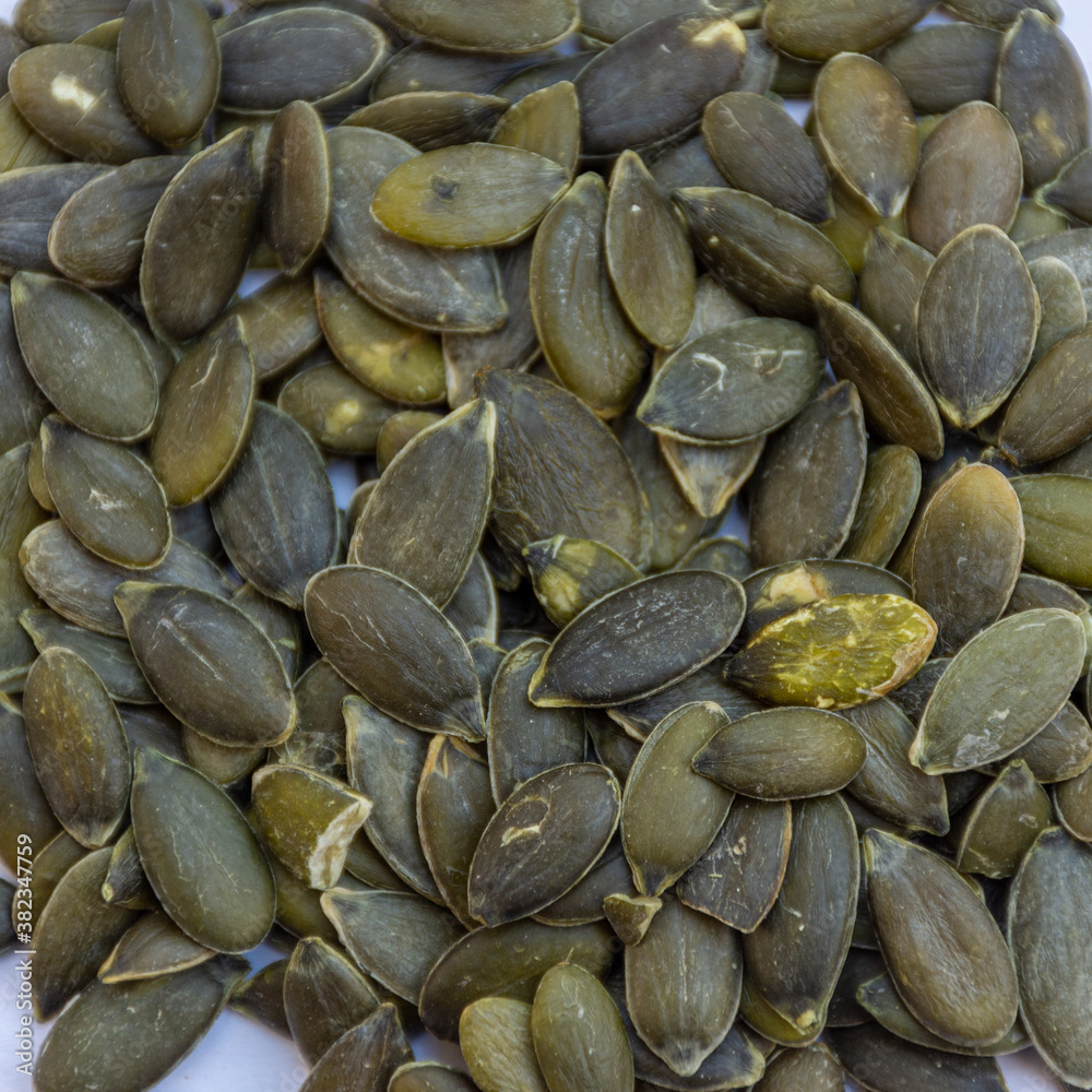 Close up of pumpkin seeds isolated on background