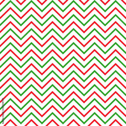 Background zigzag pattern in traditional Christmas colors. Vector seamless texture in red and green. New Year theme.