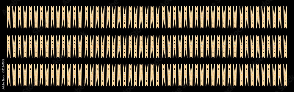 White housewife clothespins isolated on black background