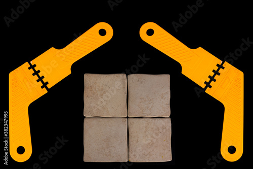 Obraz na płótnie Tools for spreading brick glue w salonie