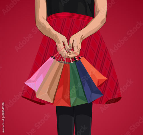 Woman holding up her shopping bags close-up