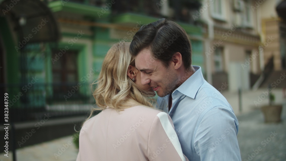 Closeup man and woman looking each other. Business couple smiling outside Closeup man and woman looking each other. Business couple smiling outside