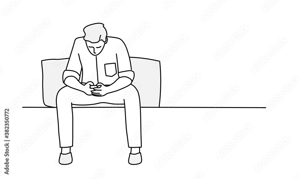 Young man is sitting on sofa and using phone. Young man is sitting on sofa and using phone.