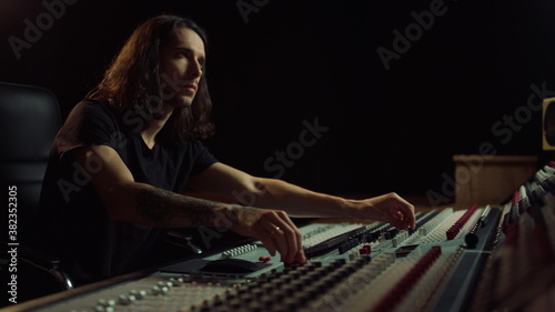 Bild auf Leinwand Thoughtful man working in music studio