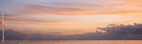 Panoramic shot of sea and cloudy sky at sunset © LIGHTFIELD STUDIOS