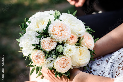 Wedding bouquet in bride's hand.