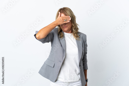 Middle aged business woman over isolated white background covering eyes by hands. Do not want to see something