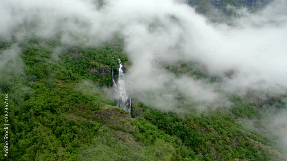 Push-in shoot in Northern waterfall in middle of forest. No people - peaceful and untouched nature. Slights clouds and rain forest feel. Push-in shoot in Northern waterfall in middle of forest. No people - peaceful and untouched nature. Slights clouds and rain forest feel.