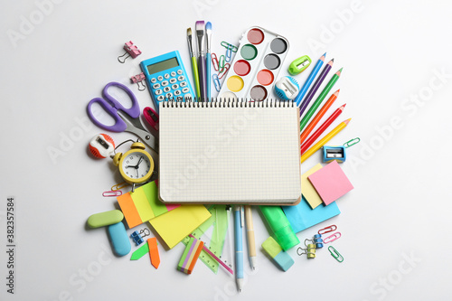 Blank notebook and school stationery on white background, flat lay with space for text. Back to school