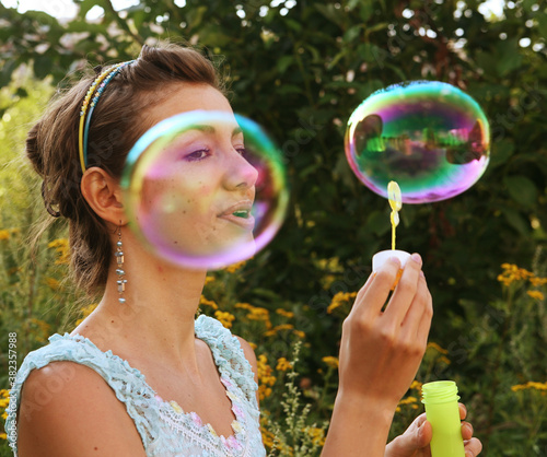 woman starts soap bubbles