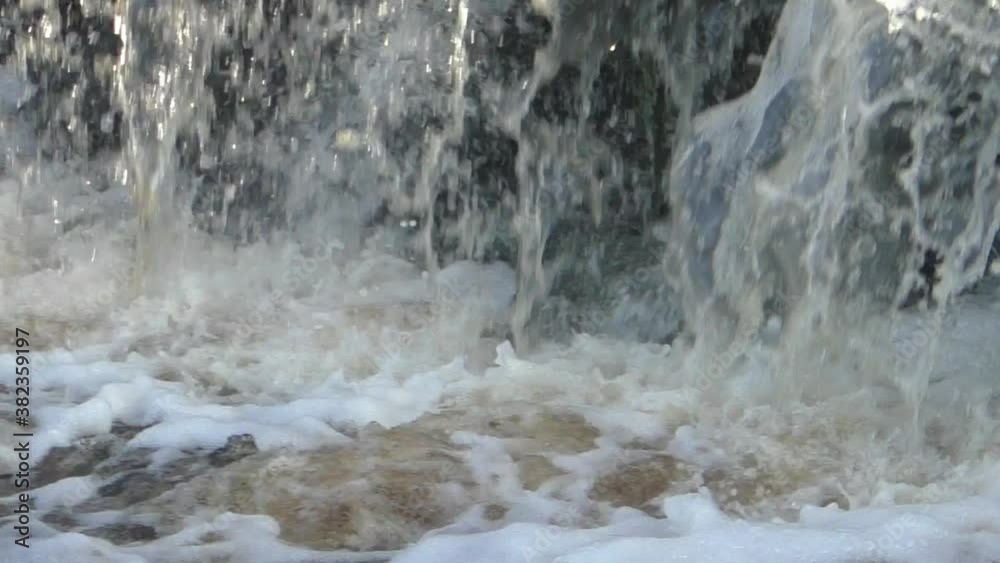 The streams wild bubbling waterfall. The landscape of the streams of falling water. The streams wild bubbling waterfall. The landscape of the streams of falling water.