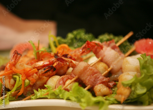 Barbequed prawn salad with shrimp lettuce and green lime