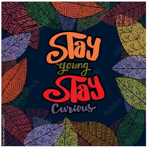 Stay young stay curious hand lettering. Quote typography. Leafs background.