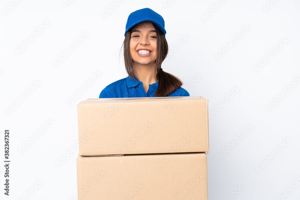 Young delivery brunette girl over isolated white background holding copyspace imaginary on the palm to insert an ad Young delivery brunette girl over isolated white background holding copyspace imaginary on the palm to insert an ad