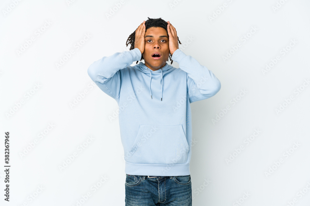 Young african american rasta man screaming, very excited, passionate, satisfied with something. Young african american rasta man screaming, very excited, passionate, satisfied with something.