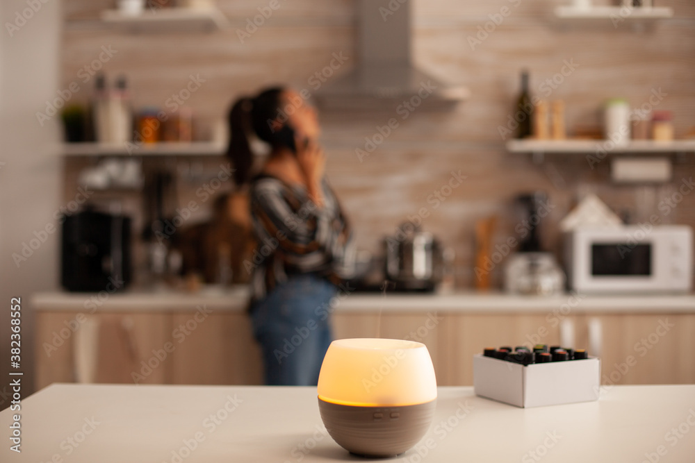 Diffusion of essential oils in kitchen for relaxation. Aroma health essence, welness aromatherapy home spa fragrance tranquil theraphy, therapeutic steam, mental health treatment.