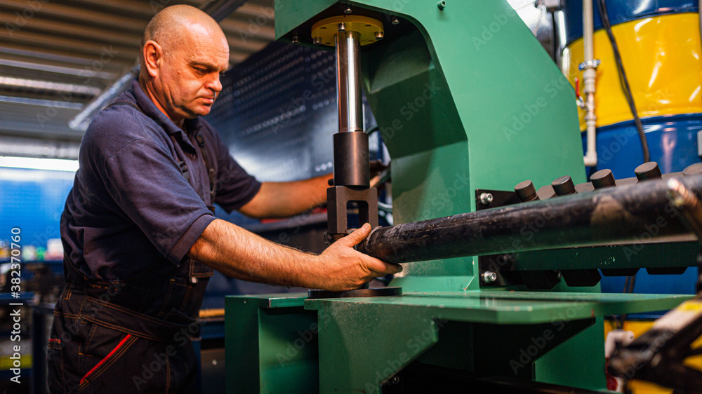Male engineer metalworker industrial experienced operator technician worker working on machine with metal, professional man in industry technology manufacturing factory workshop, artistic noise Male engineer metalworker industrial experienced operator technician worker working on machine with metal, professional man in industry technology manufacturing factory workshop, artistic noise