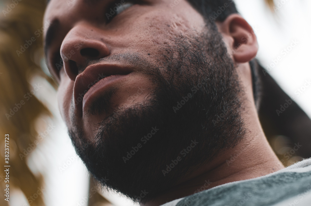 Fototapeta premium cute bearded latin man seen from below