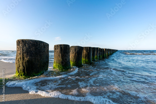 Wooden planks at a beach panorama