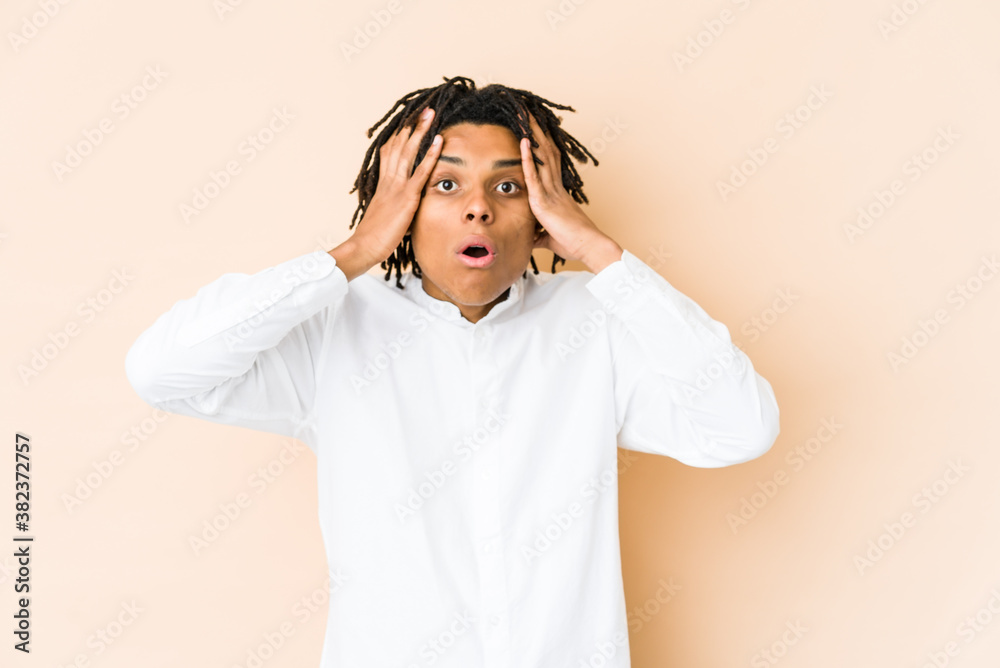 Young african american rasta man being shocked, she has remembered important meeting. Young african american rasta man being shocked, she has remembered important meeting.