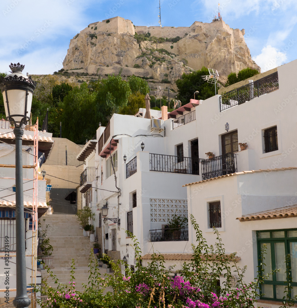 Fototapeta premium Santa Barbara Castle seen from the traditional district of Santa Cruz in the beautiful Mediterranean city of Alicante, Spain