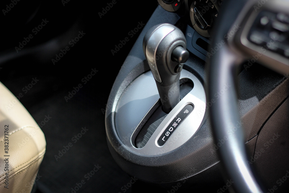 automatic transmission shift selector in the car interior. Closeup a manual shift of modern car gear sifter.