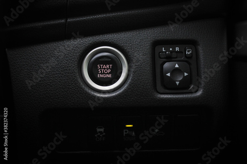 Close up engine car start button. Start stop engine modern new car button,Makes it easy to turn your auto mobile on and off. a key fob unique ,selective focus © Muanpare