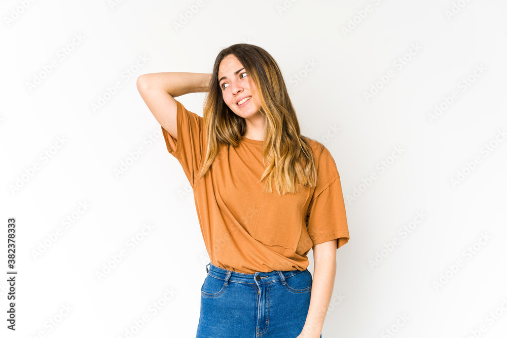 Fototapeta premium Young caucasian woman isolated on white background tired and very sleepy keeping hand on head.