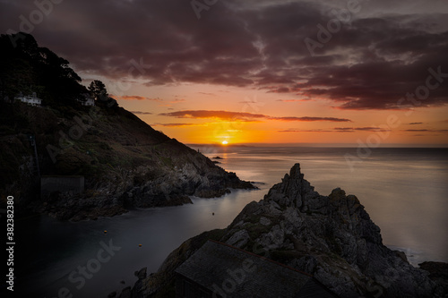 Sunrise over Rame Head from Polperro Harbour