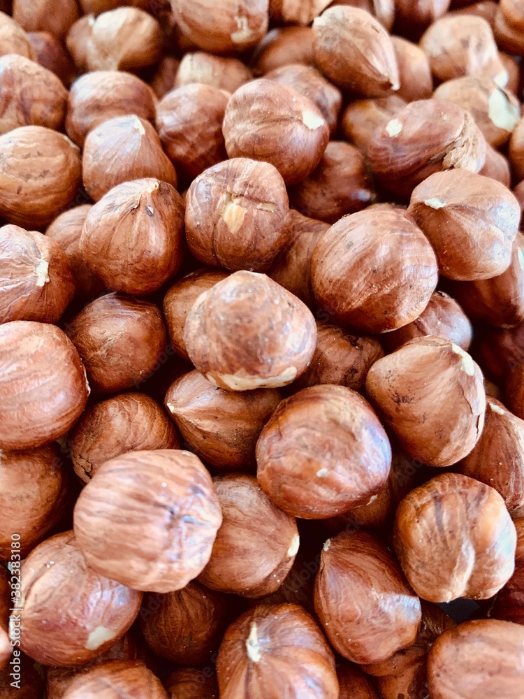 Hazelnut Background. Heap of peeled hazelnuts. Hazelnut Background. Heap of peeled hazelnuts.