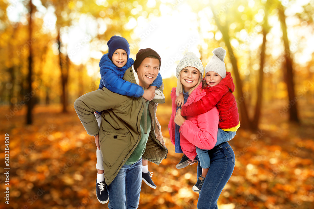 Happy family spending time together at autumn park Happy family spending time together at autumn park