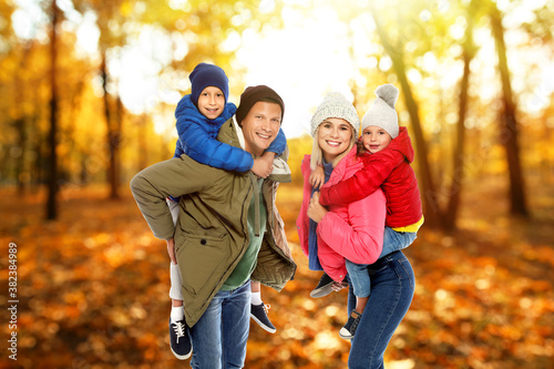 Happy family spending time together at autumn park