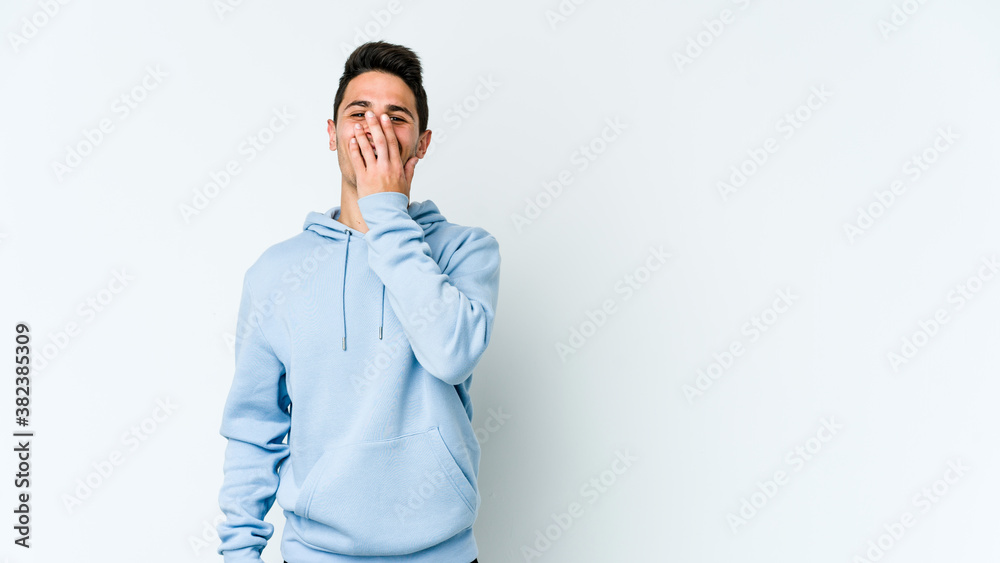 Young caucasian man isolated on white background laughing happy, carefree, natural emotion. Young caucasian man isolated on white background laughing happy, carefree, natural emotion.