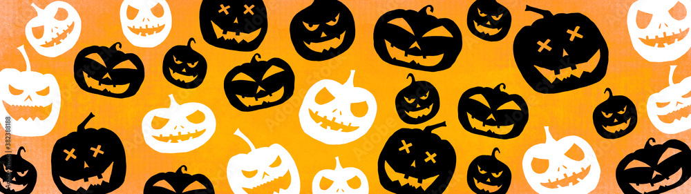 HALLOWEEN symbol background banner wide panoramic panorama template design -Top view Silhouette of scary carved luminous cartoon pumpkins isolated on dark orange yellow texture