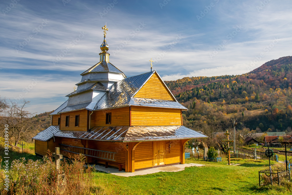 Obraz premium Scenic view of Greek Catholic wooden church of the Holy Trinity, Krushelnytsya, Lviv region, Ukraine