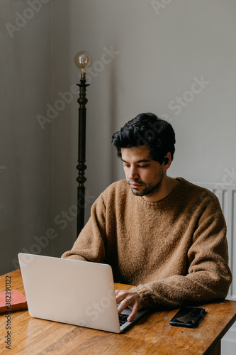 Man working on a laptop at home