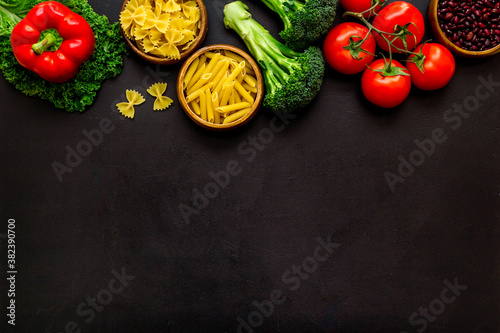 Selection of healthy food - vegetables, beans and herbs. View from above