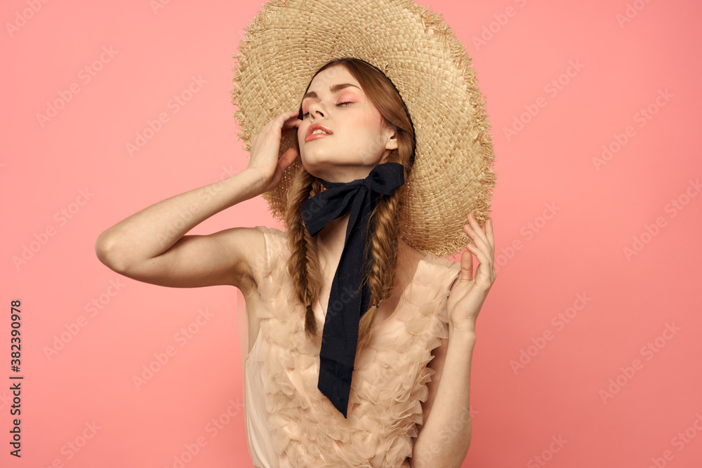 Beautiful woman in hat and in black dress ribbon portrait pink background model Beautiful woman in hat and in black dress ribbon portrait pink background model