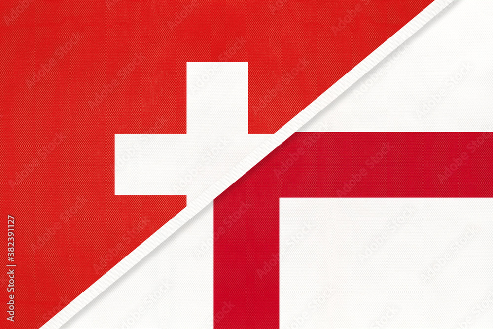 Switzerland and England, symbol of national flags from textile. Championship between two countries. Switzerland and England, symbol of national flags from textile. Championship between two countries.