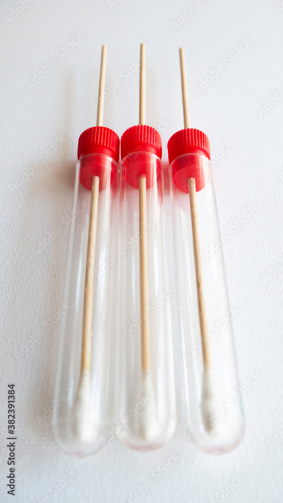 Sterile test swap tubes on white background. Sterile test swap tubes on white background.