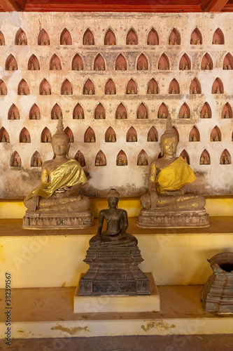 Temples at Luang Prabang Laos with Buddha statues and detailed golden shrines