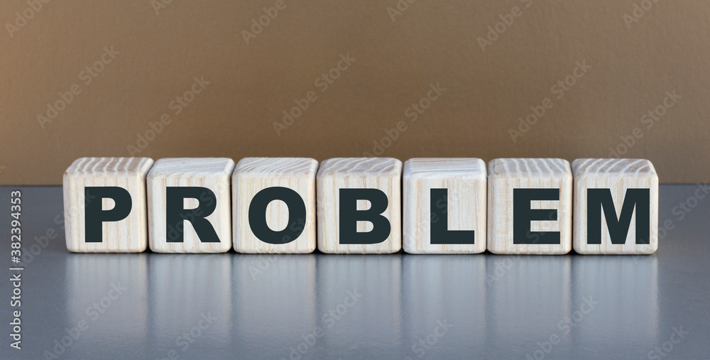 Obraz premium Problem - word on wooden cubes on a beautiful gray background
