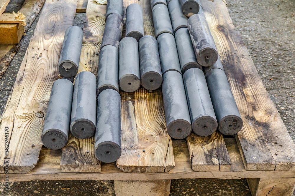 Hardened round blanks for parts after heat treatment lie on a wo Hardened round blanks for parts after heat treatment lie on a wo