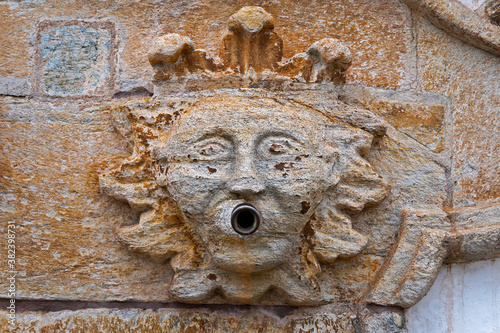 Ancient baroque fountain (detail) in historical city of Ouro Preto, Brazil