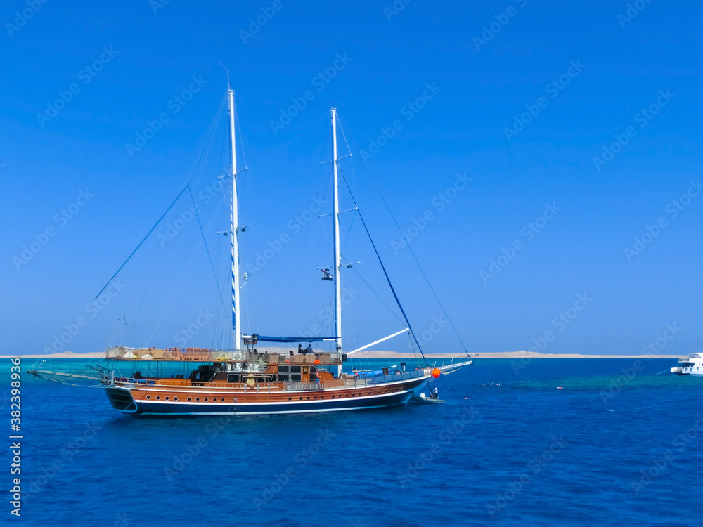 Sail boat ship with tourists in Ras Mohamed National Park in the Red Sea, Sharm El Sheikh Sail boat ship with tourists in Ras Mohamed National Park in the Red Sea, Sharm El Sheikh