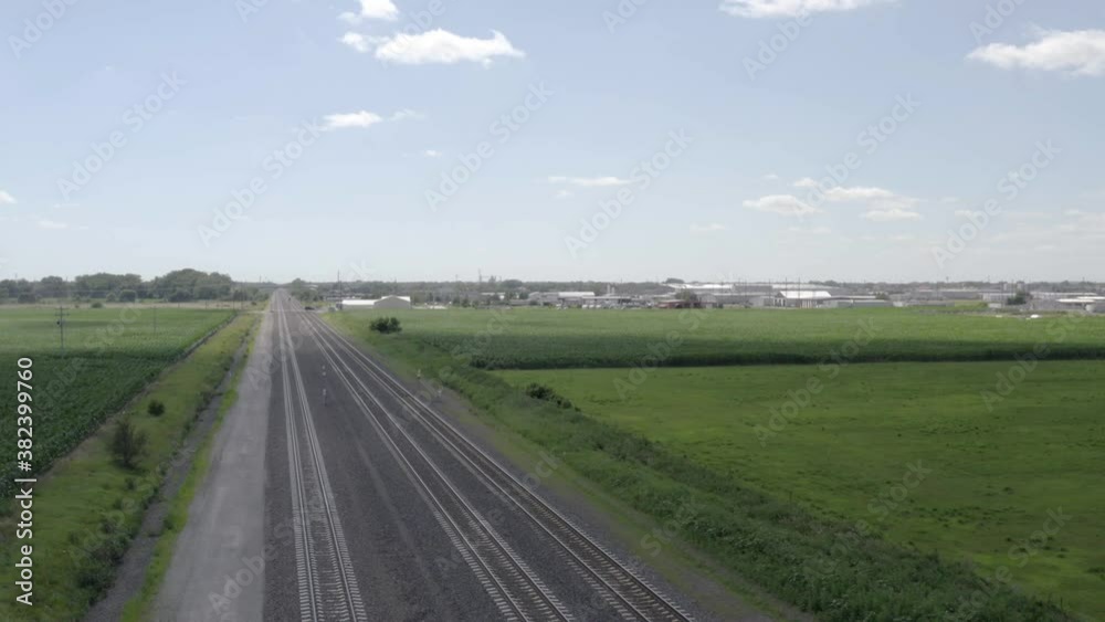 drone shot passing and circling around train tracks drone shot passing and circling around train tracks
