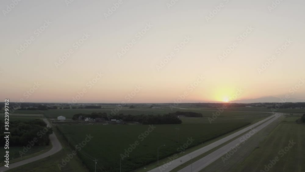 drone shot over fields and train tracks in the sunset drone shot over fields and train tracks in the sunset