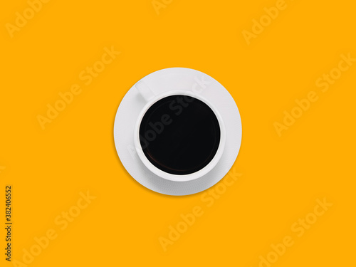Black coffee Photo in minimal style with copy space White plate with cup of americano is standing on a bright yellow background