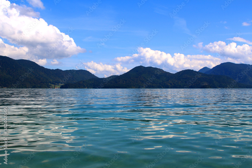 Sunny day at a mountain lake under blue skies (Walchensee, Bavaria, Germany)